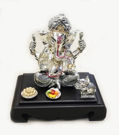 Gorgeous Silver Mukut Ganesha set on a wooden chowki, 10.5″ – Resin Silver