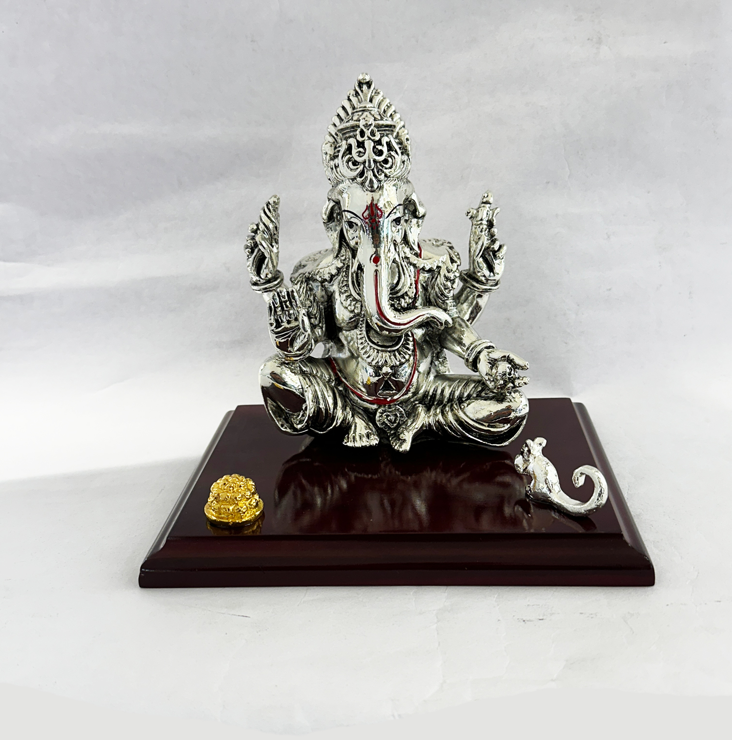 Artistic Mukut Ganesha set on a wooden chowki | 7 Inch Height