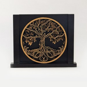 Circular wooden tree-of-life cutout mounted on a black display box.