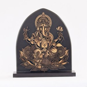 Wooden laser-cut panel depicting the Hindu deity Ganesha with multiple arms, seated on a lotus, in an arched, black background art piece on a pedestal