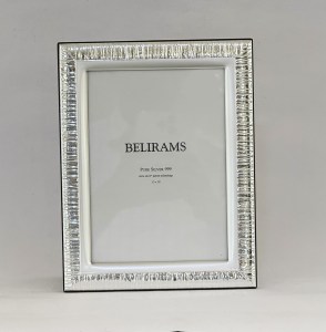 Silver rectangular picture frame with a ribbed, mirrored border and white inner mat, showing the word BELIRAMS and 'Pure Silver 999' text inside.