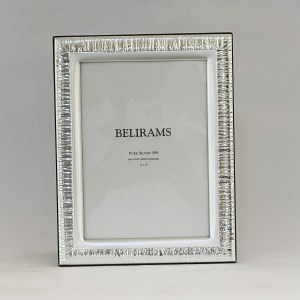 Silver rectangular picture frame with a ribbed, mirrored border and white inner mat, showing the word BELIRAMS and 'Pure Silver 999' text inside.