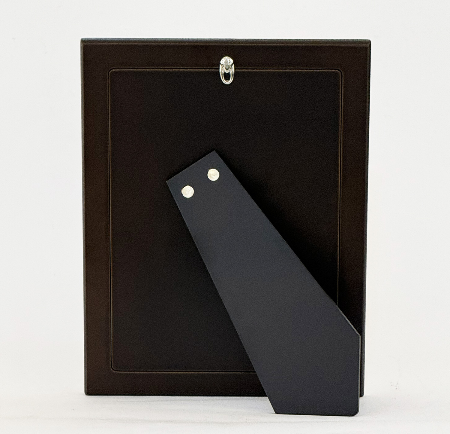 Back view of a black rectangular frame with a dark gray diagonal metal support attached by two rivets at the top area of the brace.