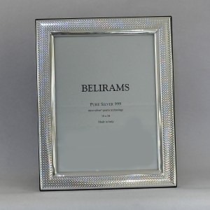 Silver decorative frame with a textured border, containing the text 'BELIRAMS' and 'Pure Silver 999'.